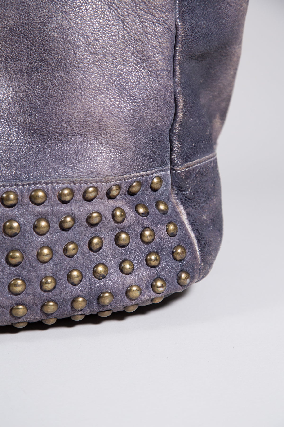 DISTRESSED LEATHER STUDDED SHOULDER BAG
