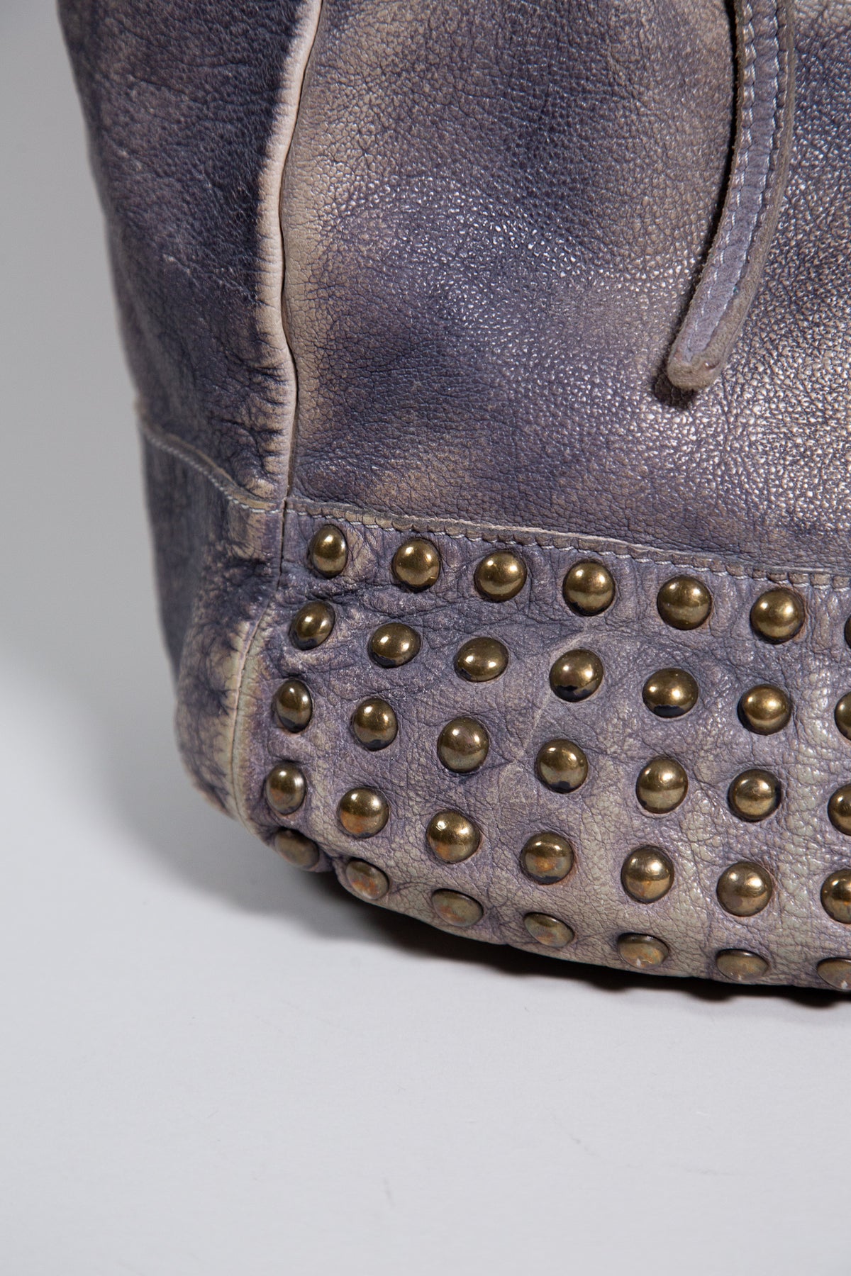 DISTRESSED LEATHER STUDDED SHOULDER BAG