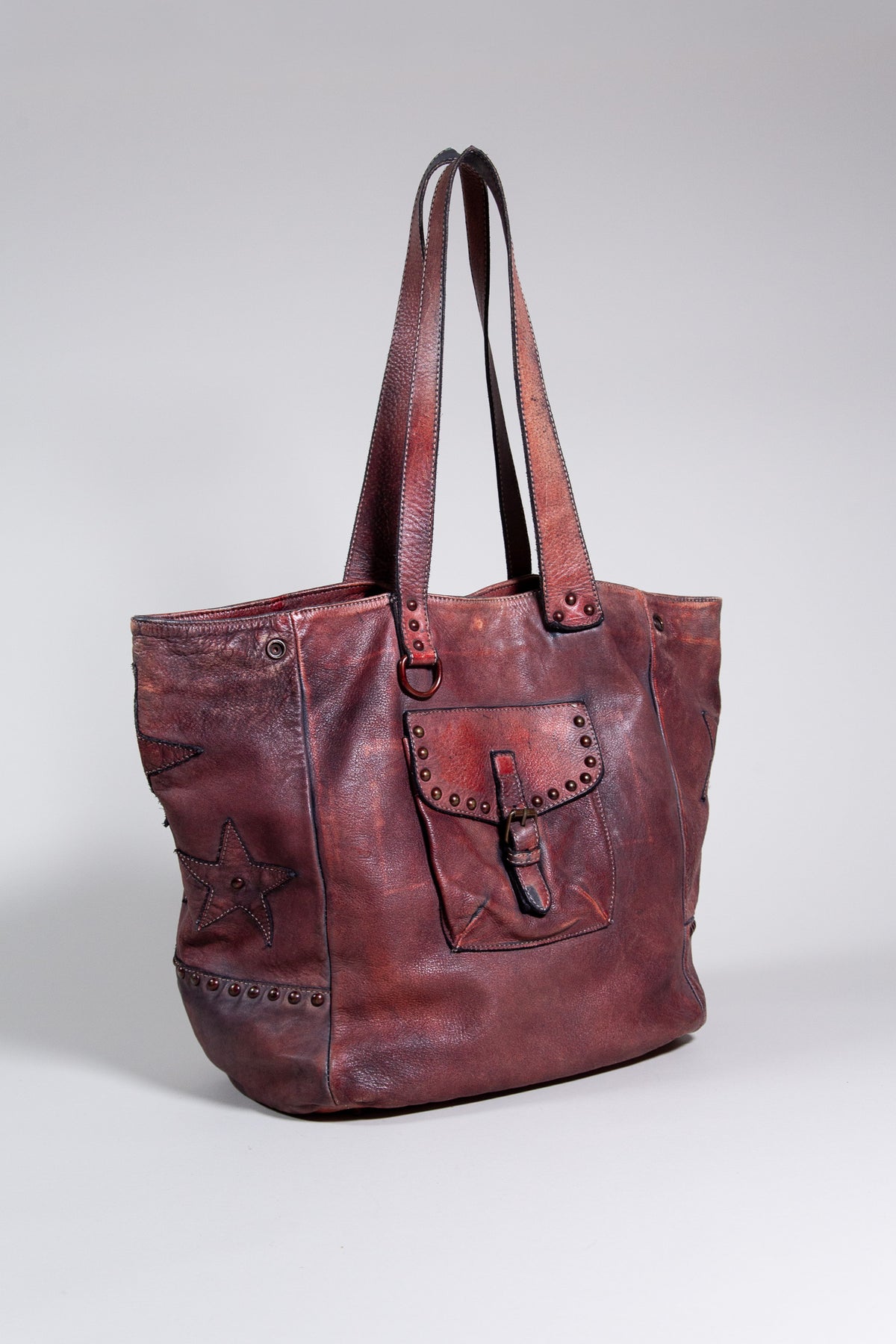 BURGUNDY DISTRESSED LEATHER STAR STUDDED TOTE BAG