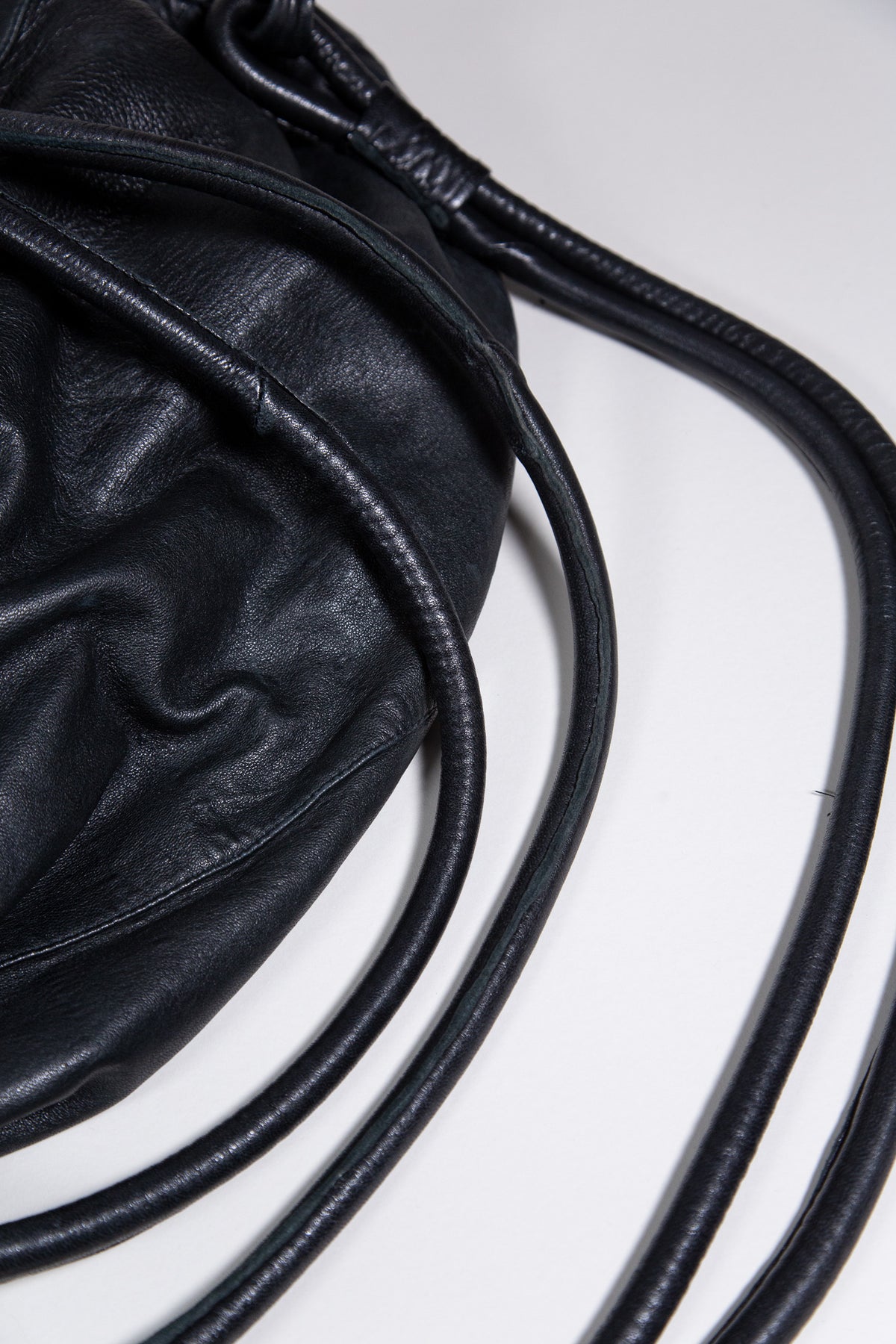 BLACK LEATHER MULTI-STRAP BACKPACK BAG