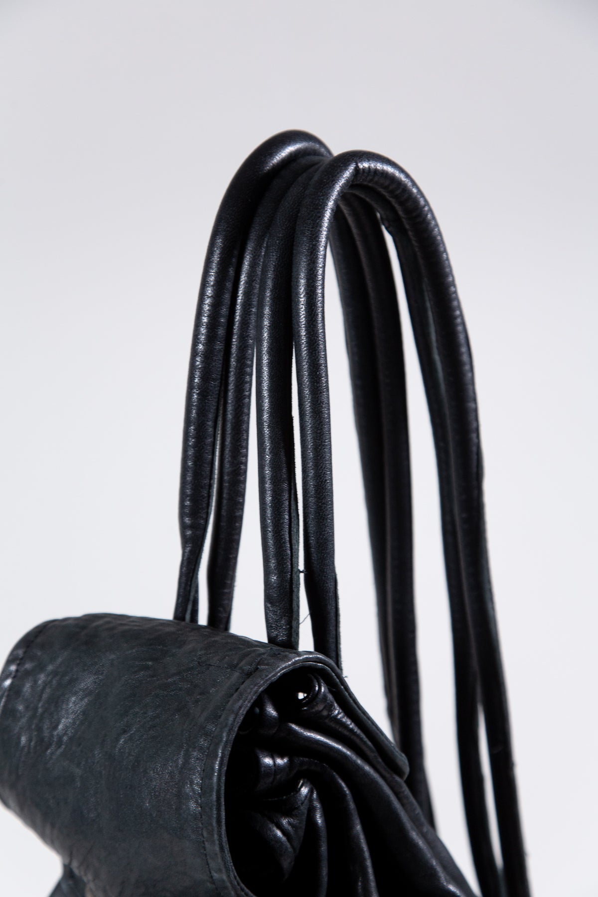 BLACK LEATHER MULTI-STRAP BACKPACK BAG