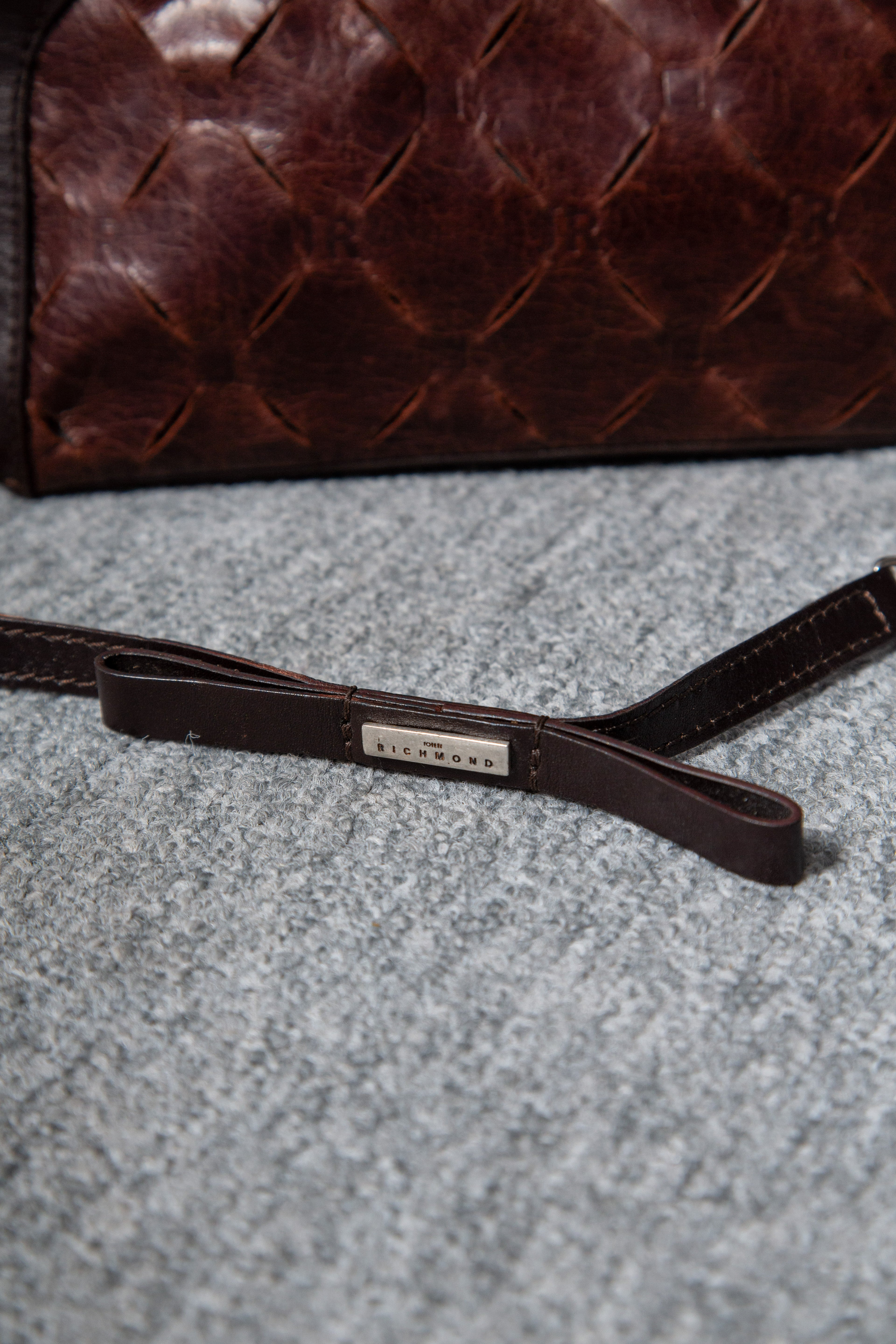 LEATHER CARMS HANDBAG