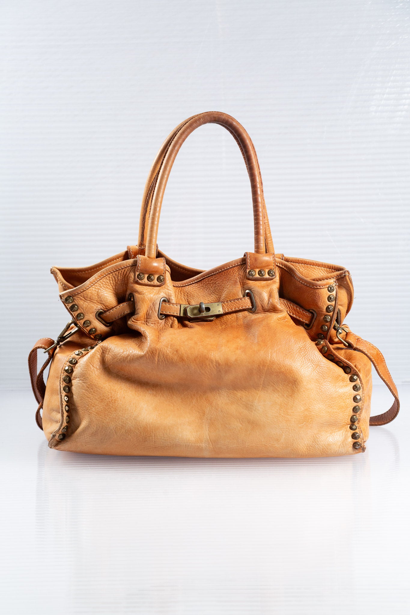 WASHED BROWN STUDDED FIRKIN LEATHER HANDBAG