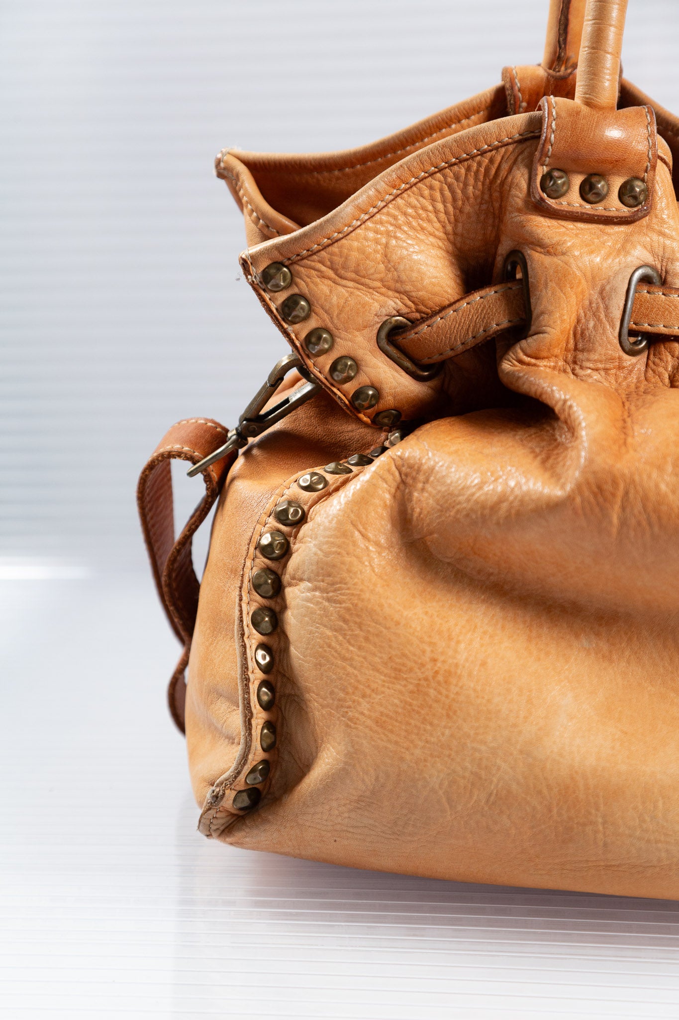 WASHED BROWN STUDDED FIRKIN LEATHER HANDBAG