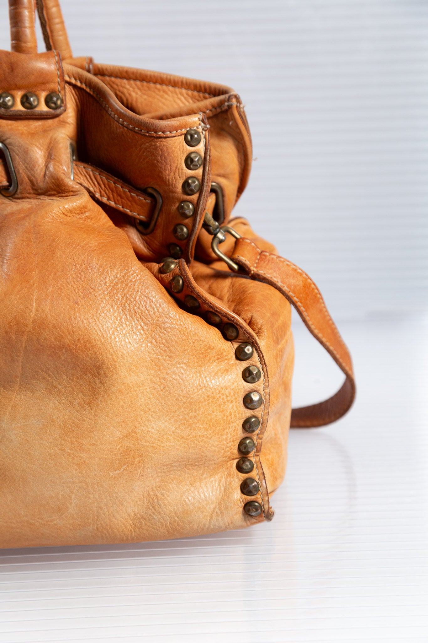 WASHED BROWN STUDDED FIRKIN LEATHER HANDBAG