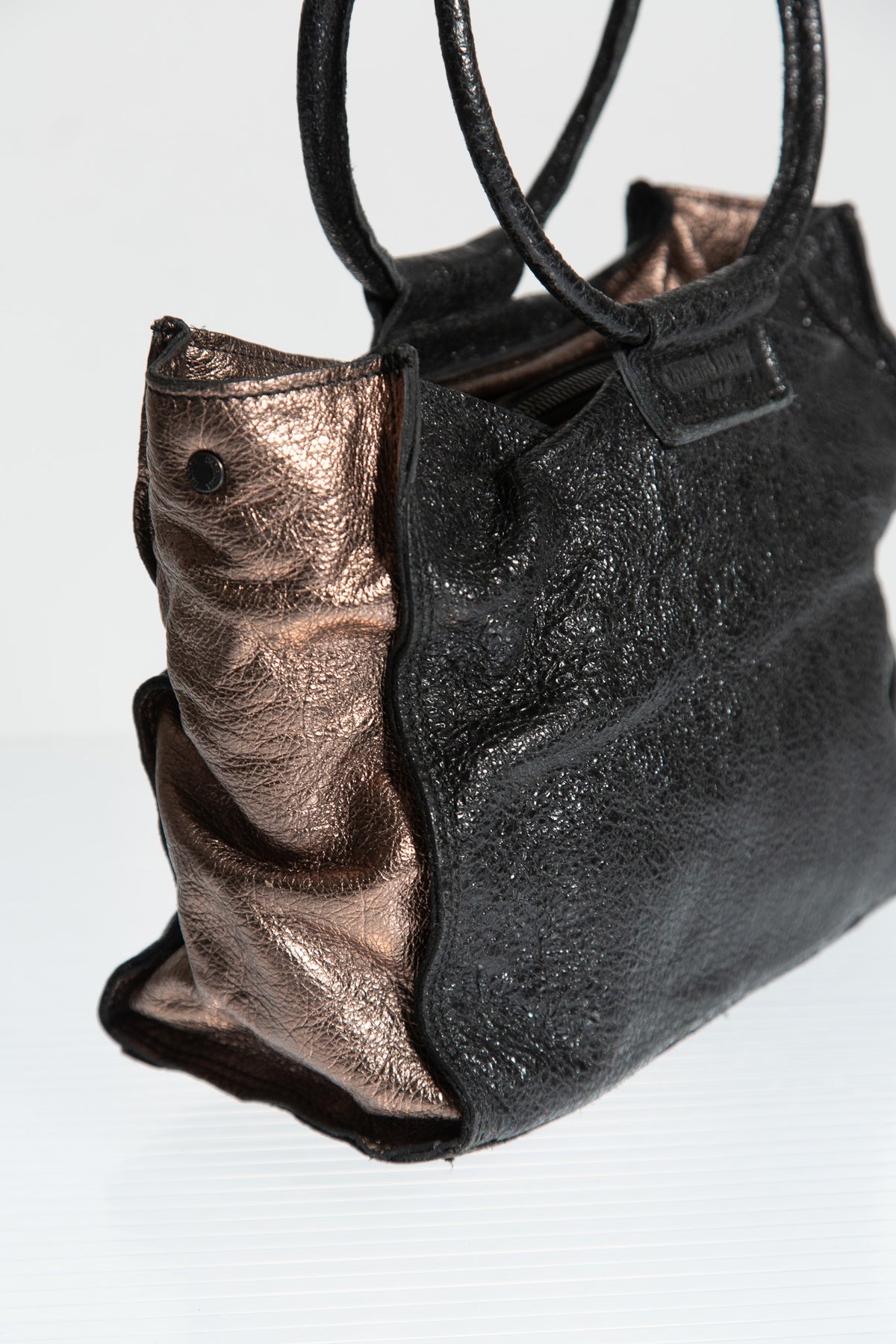 BRONZE LEATHER SCULPTURAL HANDLE BAG