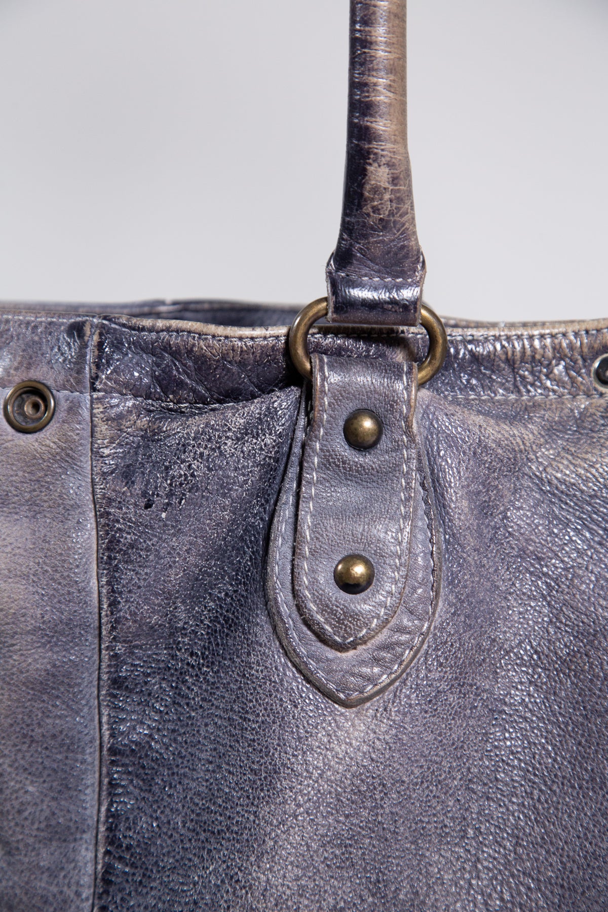 DISTRESSED LEATHER STUDDED SHOULDER BAG