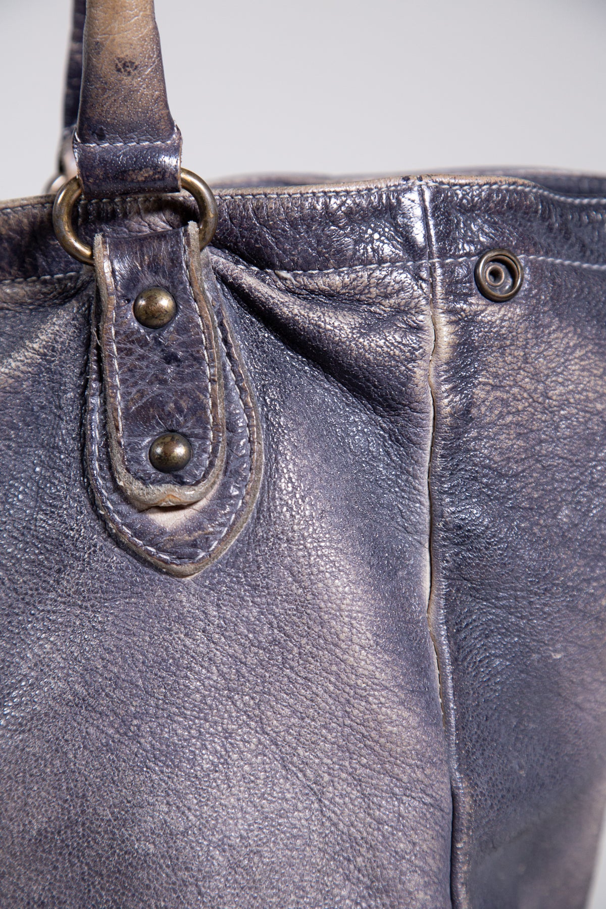 DISTRESSED LEATHER STUDDED SHOULDER BAG
