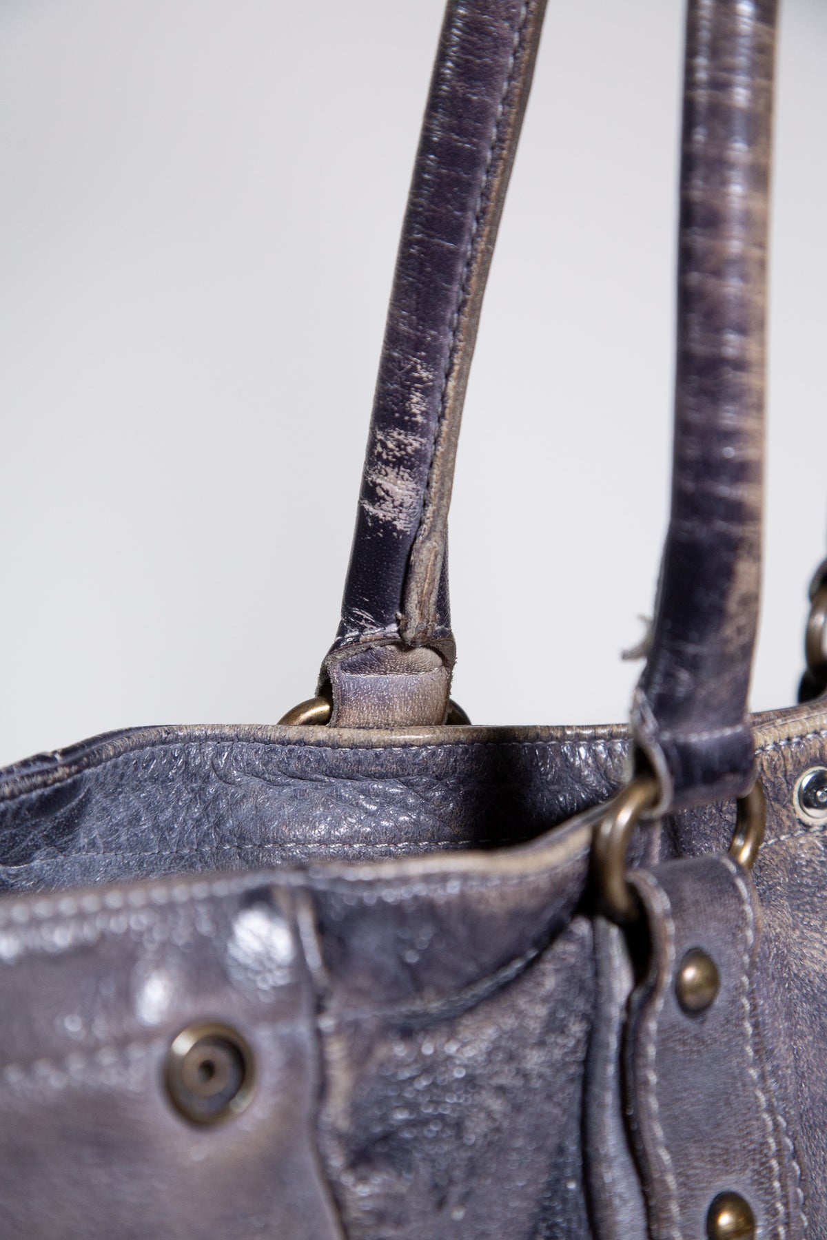DISTRESSED LEATHER STUDDED SHOULDER BAG