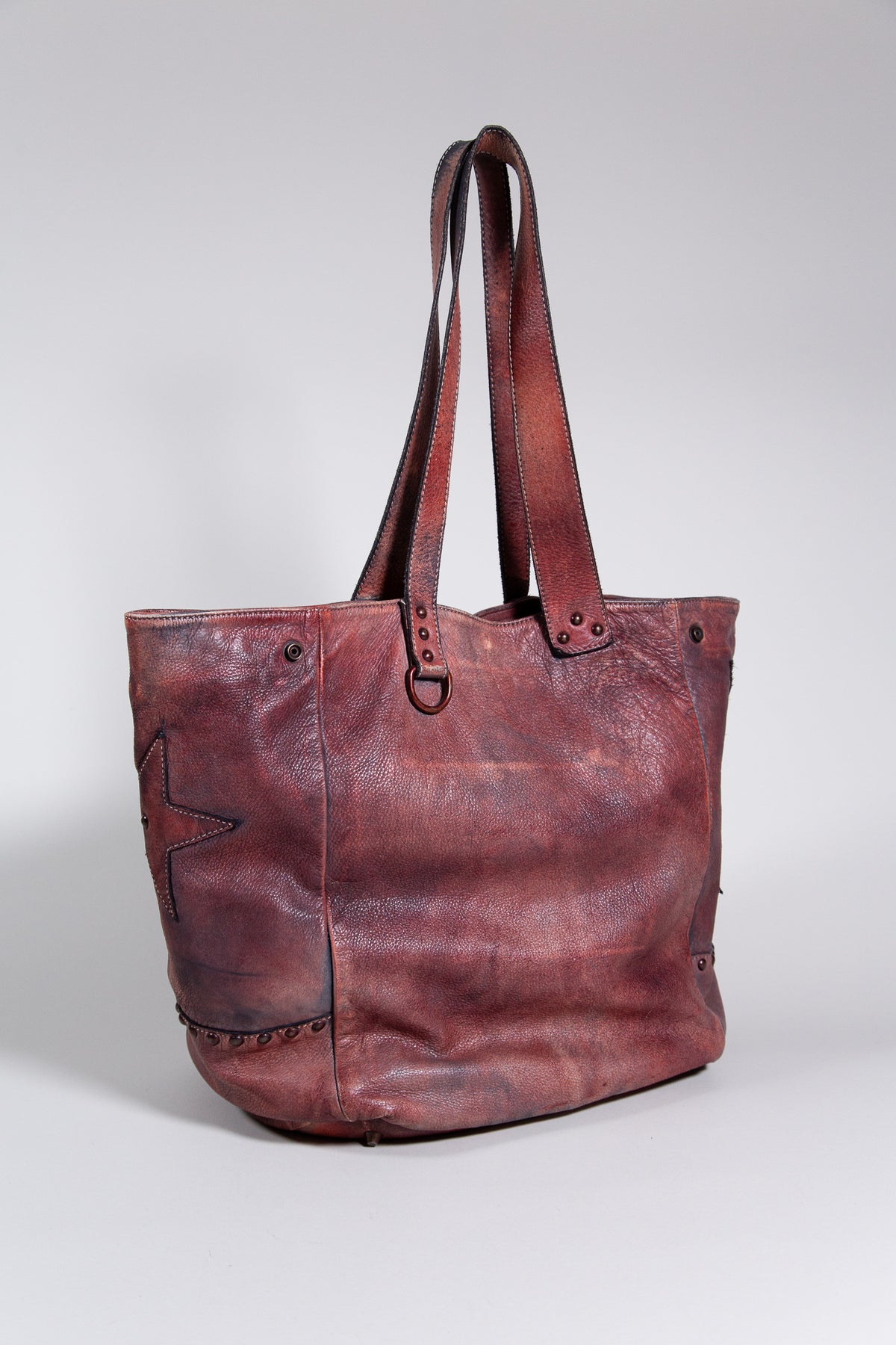 BURGUNDY DISTRESSED LEATHER STAR STUDDED TOTE BAG