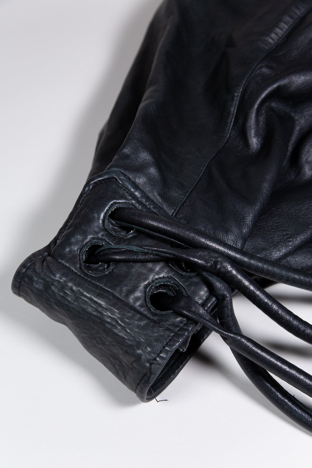 BLACK LEATHER MULTI-STRAP BACKPACK BAG