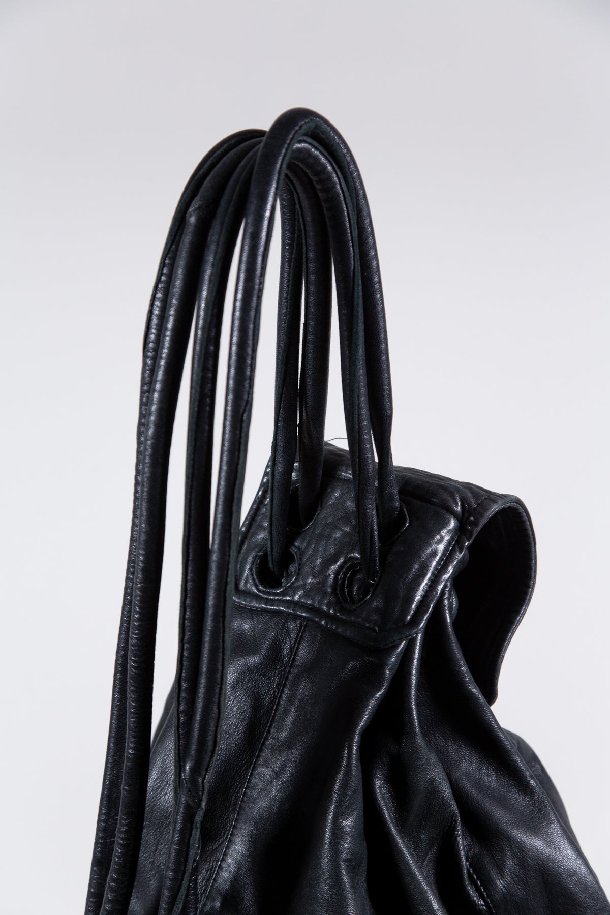 BLACK LEATHER MULTI-STRAP BACKPACK BAG
