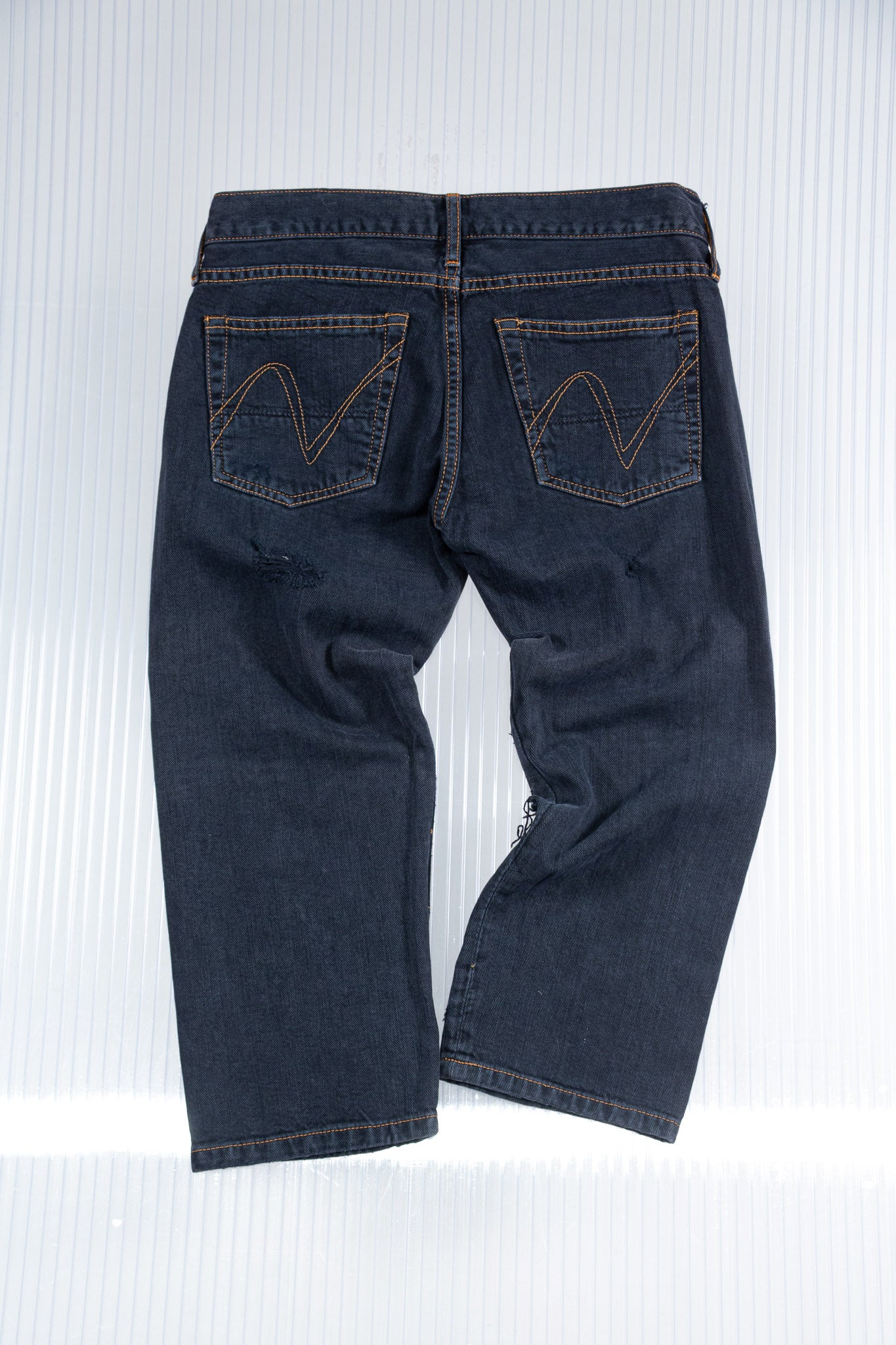 DISTRESSED SILVER STUDDED CAPRI PANTS