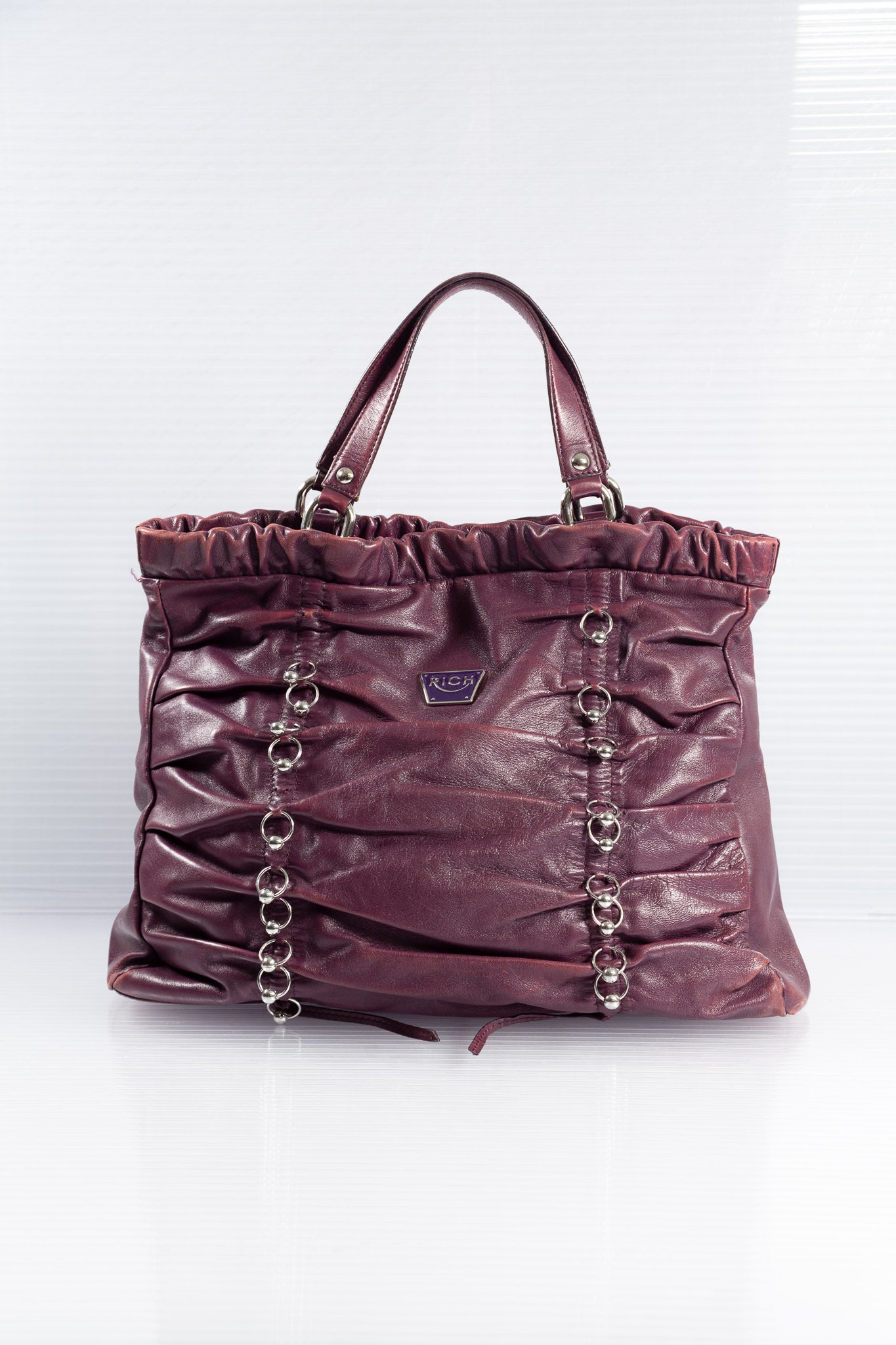 PURPLE PIERCED RUCHED LEATHER BAG