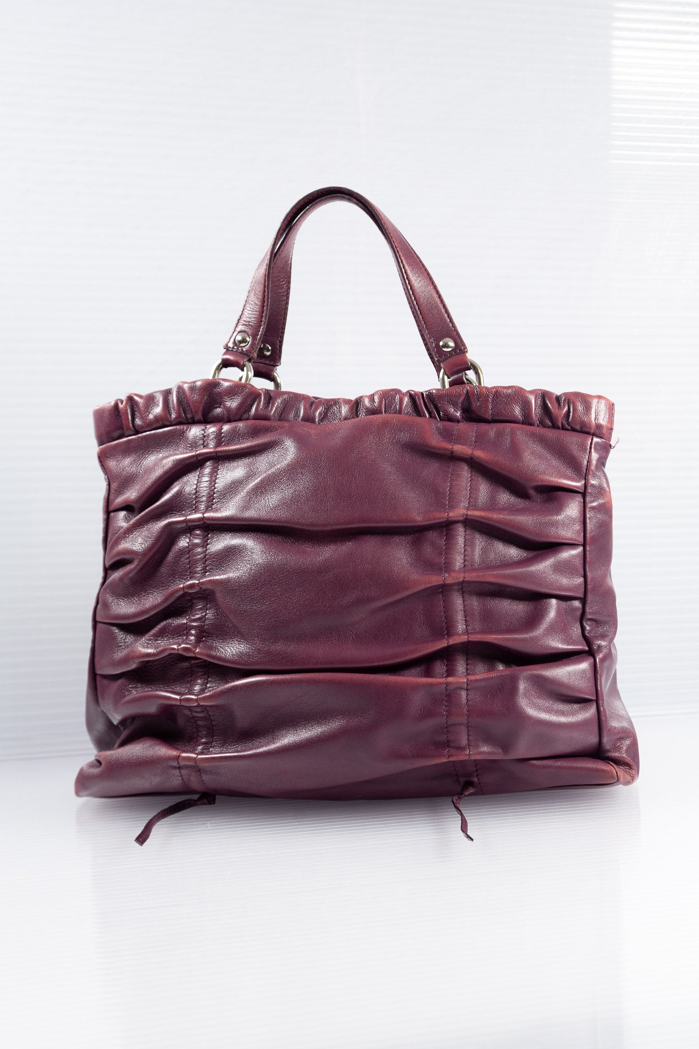 PURPLE PIERCED RUCHED LEATHER BAG