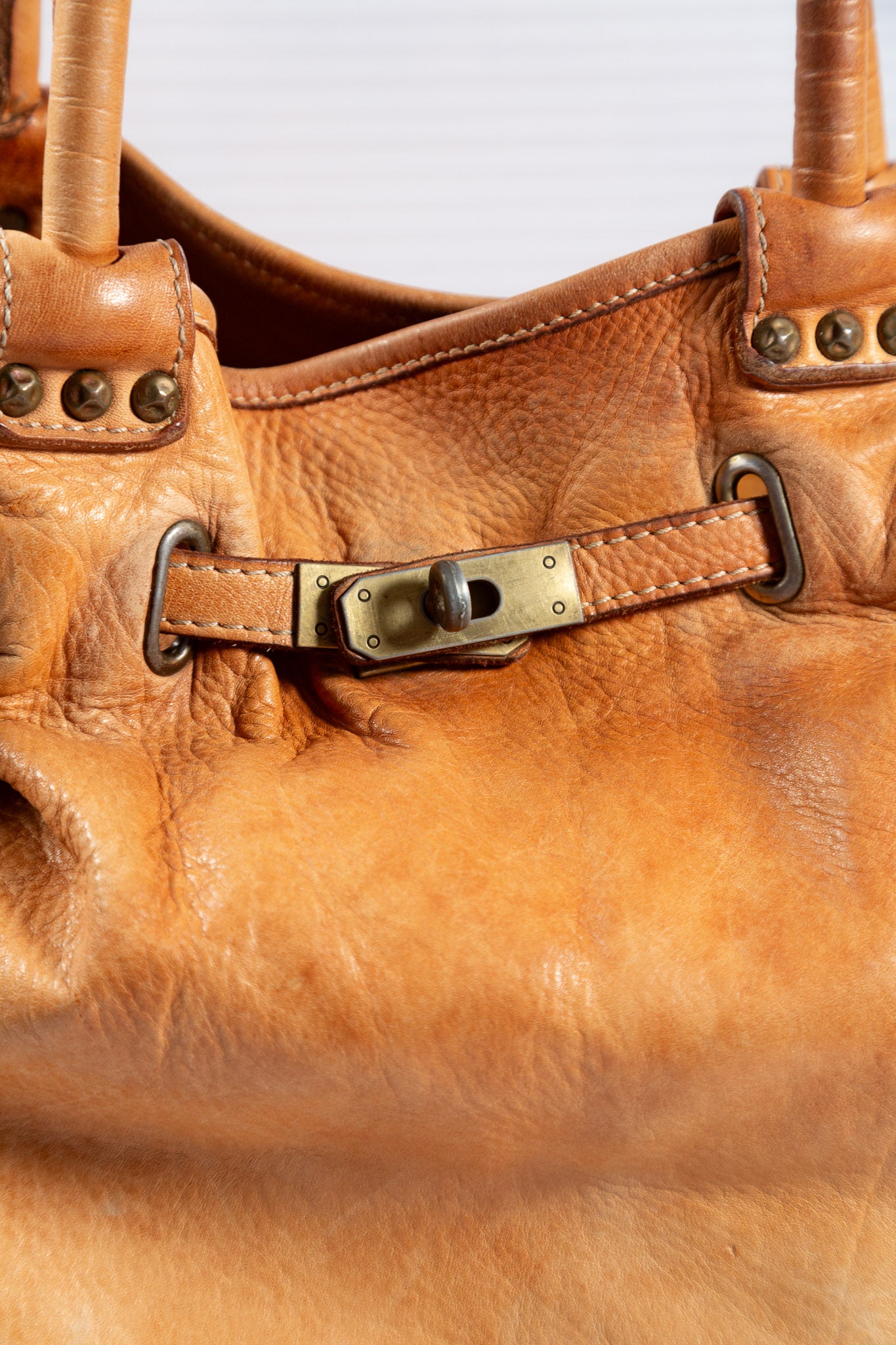WASHED BROWN STUDDED FIRKIN LEATHER HANDBAG
