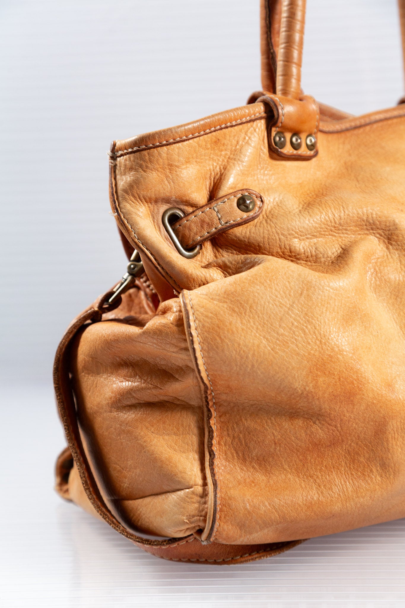 WASHED BROWN STUDDED FIRKIN LEATHER HANDBAG