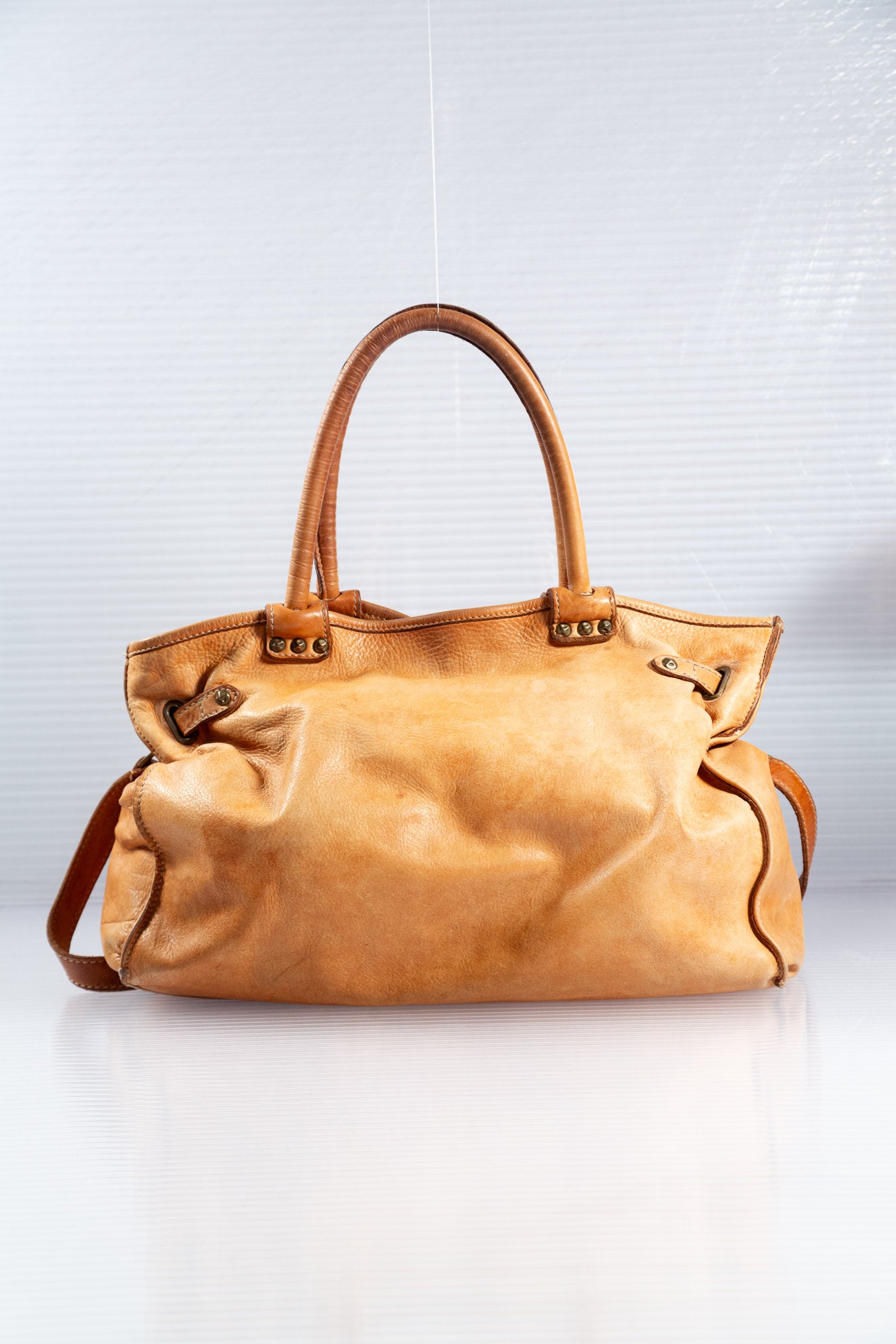 WASHED BROWN STUDDED FIRKIN LEATHER HANDBAG