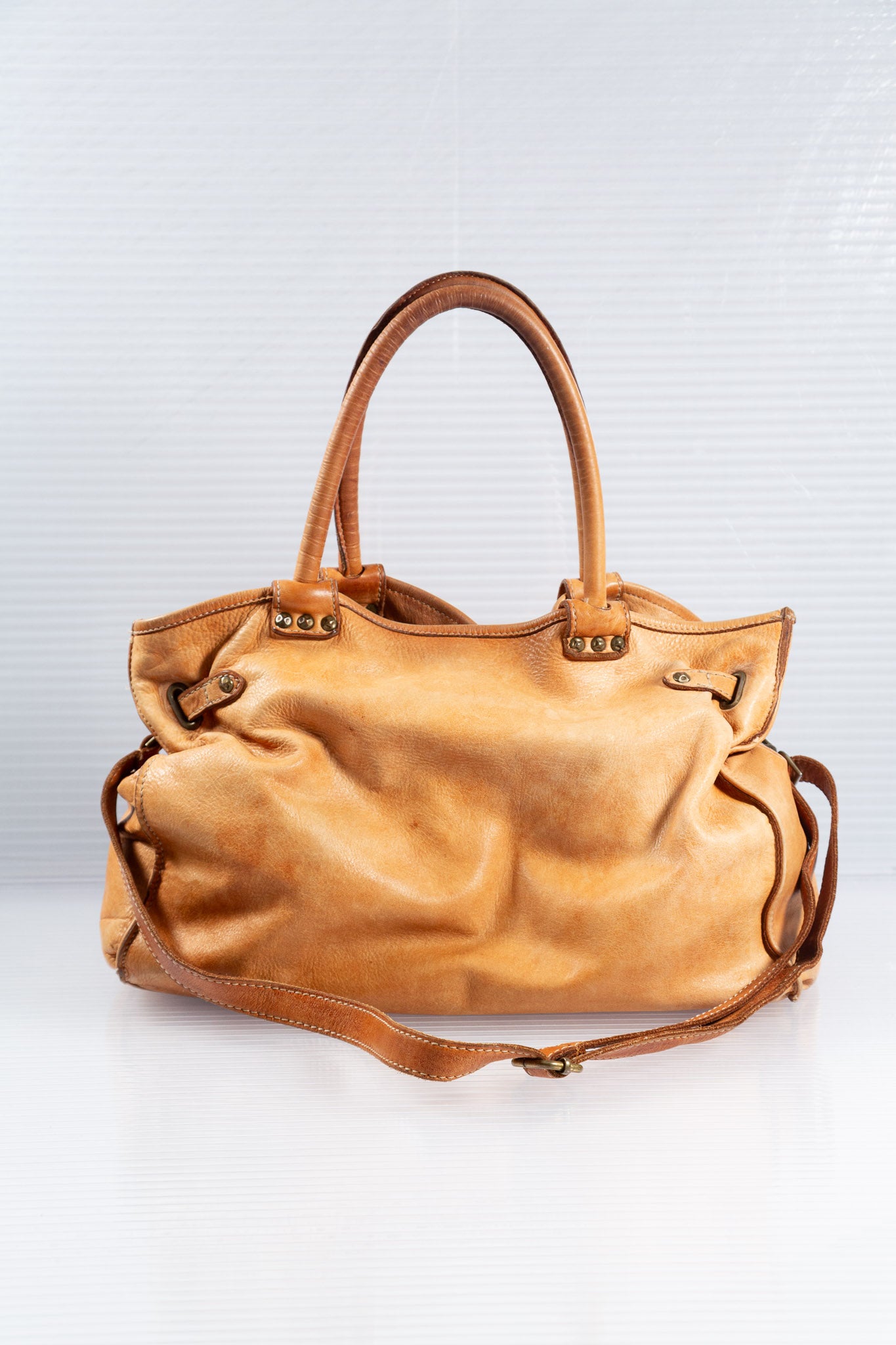 WASHED BROWN STUDDED FIRKIN LEATHER HANDBAG