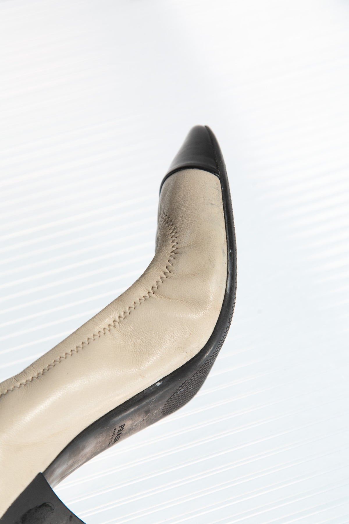 PRADA CREAM LEATHER PUMPS WITH BLACK TOE CAP